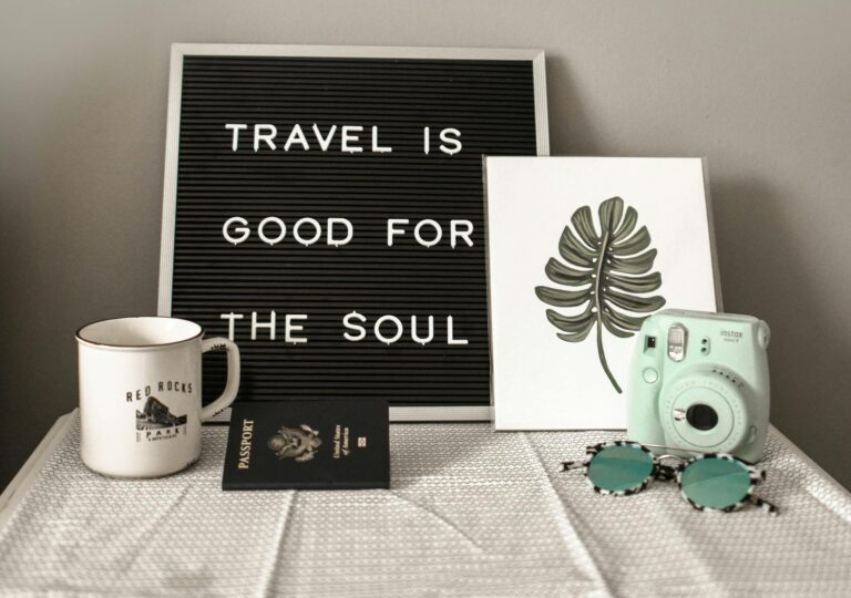 Teal Fujifilm Instax Mini Camera Near White Ceramic Mug